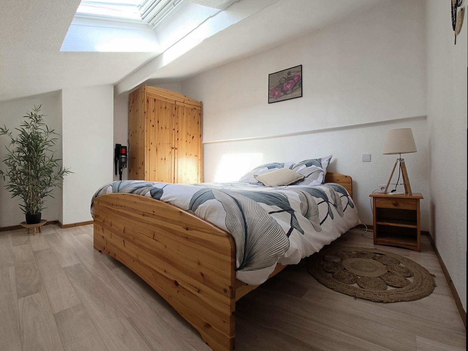 Chambre parentale avec lit double dans la maison de vacances Les Tamarins